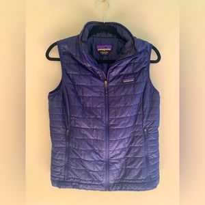 Classic Navy Patagonia Nano Puff zip up vest.